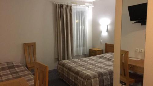 Imagen de la habitación del Hotel Le Relais Du Montagny. Foto 9