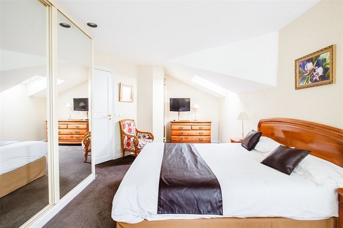 Imagen de la habitación del Hotel Le Relais Saint Michel. Foto 5