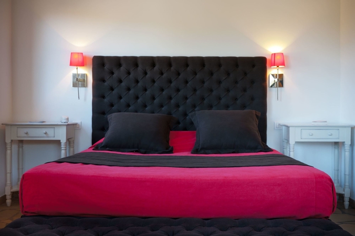 Imagen de la habitación del Hotel Le Roc E Fiori. Foto 9