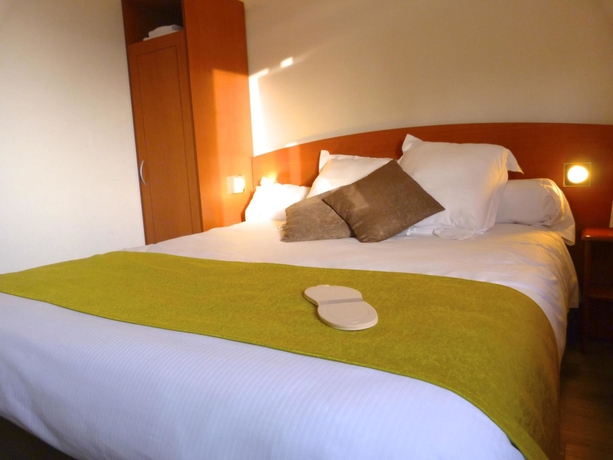 Imagen de la habitación del Hotel Le Roxane. Foto 15