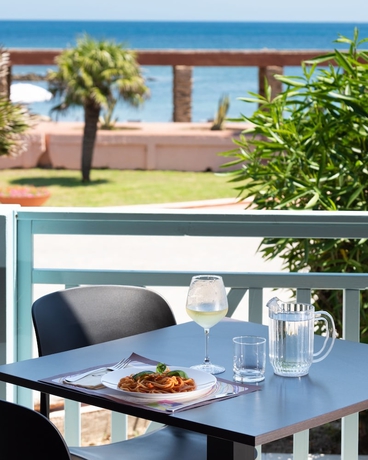 Imagen del bar/restaurante del Hotel Le Tonnare Di Stintino - Beach Resort. Foto 9