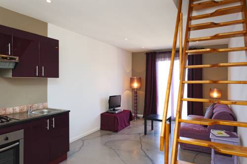 Imagen de la habitación del Hotel Le Tourisme. Foto 9