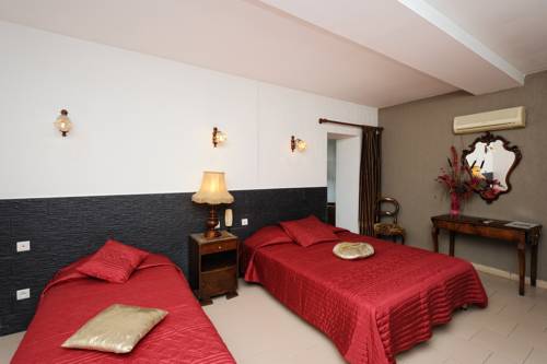 Imagen de la habitación del Hotel Le Tourisme. Foto 11