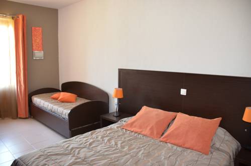 Imagen de la habitación del Hotel Le Tourisme. Foto 14