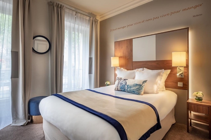 Imagen de la habitación del Hotel Le Tourville by Inwood Hotels. Foto 7