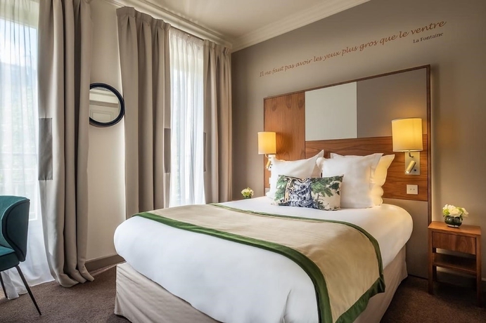 Imagen de la habitación del Hotel Le Tourville by Inwood Hotels. Foto 11