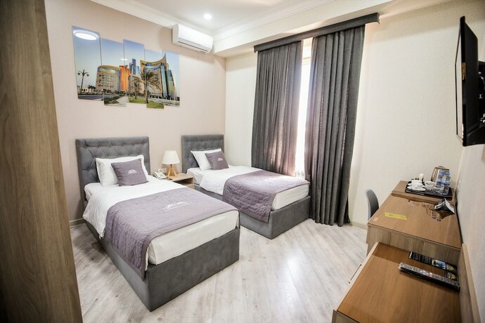 Imagen de la habitación del Hotel Leader, Taskent. Foto 17