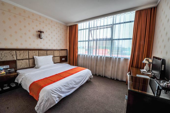 Imagen de la habitación del Hotel Lecheng Hotel. Foto 6