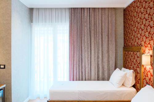 Imagen de la habitación del Hotel Ledina. Foto 19