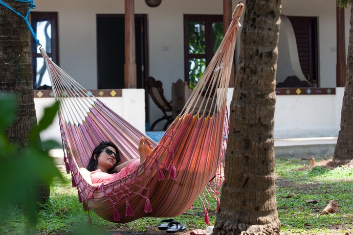 Imagen de la habitación del Hotel Leela Cottages. Foto 4