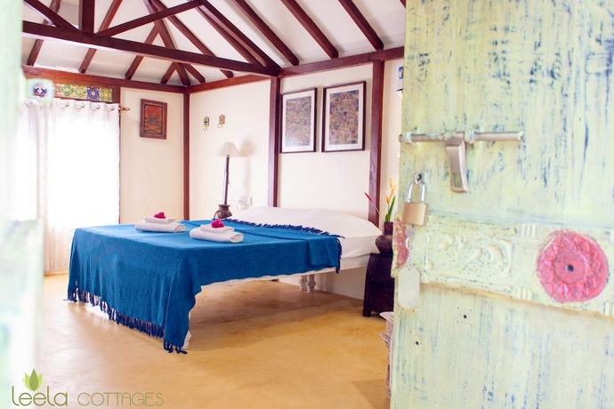 Imagen de la habitación del Hotel Leela Cottages. Foto 7