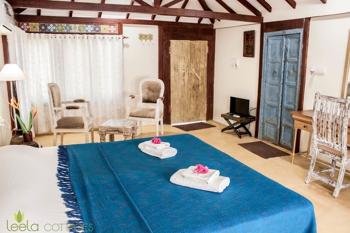 Imagen de la habitación del Hotel Leela Cottages. Foto 9