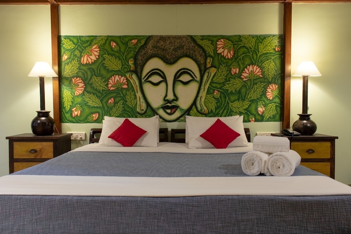 Imagen de la habitación del Hotel Leela Cottages. Foto 10