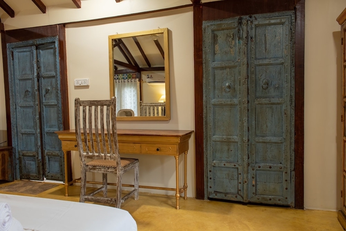 Imagen de la habitación del Hotel Leela Cottages. Foto 13