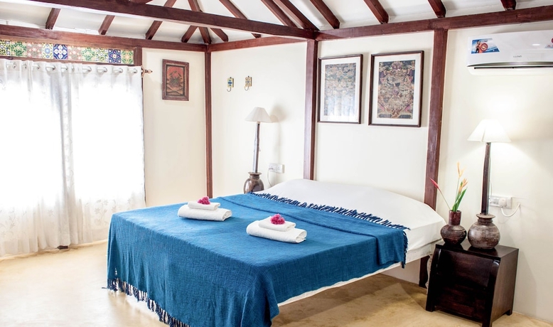 Imagen de la habitación del Hotel Leela Cottages. Foto 16