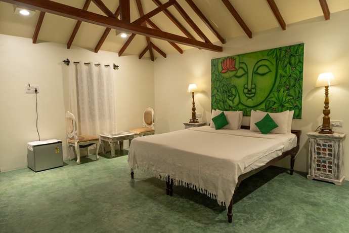 Imagen de la habitación del Hotel Leela Cottages. Foto 18