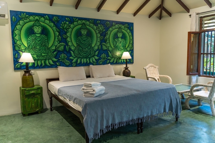 Imagen de la habitación del Hotel Leela Cottages. Foto 19