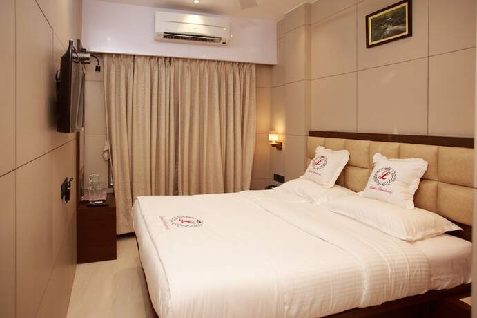 Imagen de la habitación del Hotel Leela. Foto 23