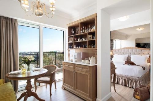 Imagen de la habitación del Hotel Legacy Gastro Suites. Foto 8