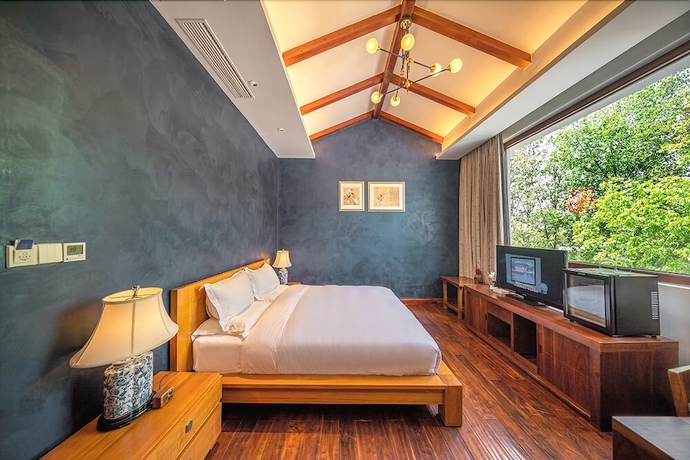 Imagen de la habitación del Hotel Leliving Butterfly Resort Lijiang. Foto 7