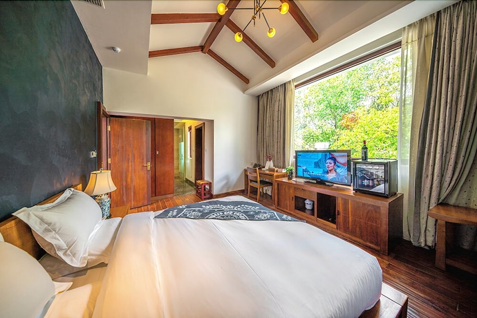 Imagen de la habitación del Hotel Leliving Butterfly Resort Lijiang. Foto 10