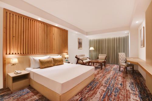 Imagen de la habitación del Hotel Lemon Tree, Haridwar. Foto 19