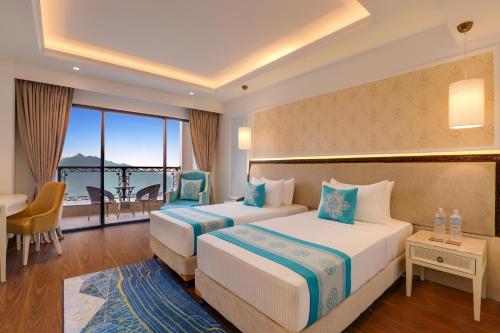 Imagen de la habitación del Hotel Lemon Tree Premier Budhanilkantha Kathmandu, Nepal. Foto 14