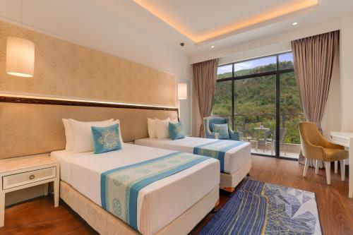 Imagen de la habitación del Hotel Lemon Tree Premier Budhanilkantha Kathmandu, Nepal. Foto 16