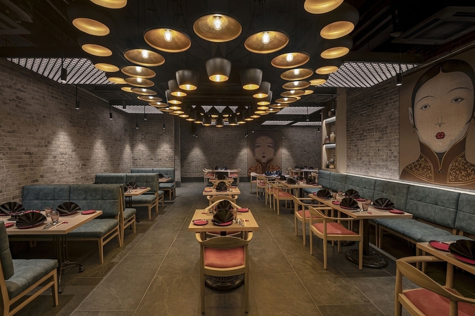 Imagen del bar/restaurante del Hotel Lemon Tree Premier New Town Kolkata. Foto 2