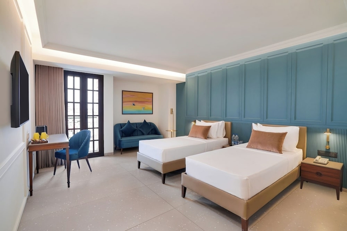 Imagen de la habitación del Hotel Lemon Tree Rajkot. Foto 2