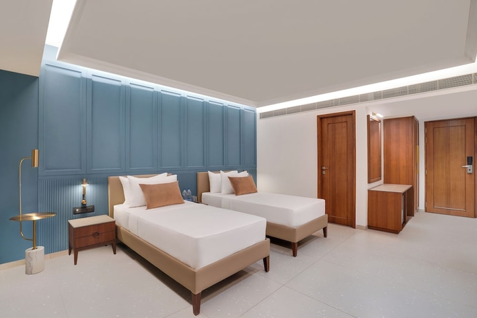 Imagen de la habitación del Hotel Lemon Tree Rajkot. Foto 3