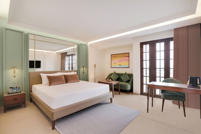 Imagen de la habitación del Hotel Lemon Tree Rajkot. Foto 6