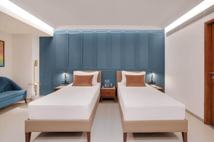 Imagen de la habitación del Hotel Lemon Tree Rajkot. Foto 10