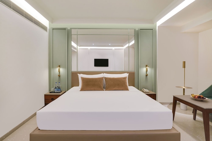 Imagen de la habitación del Hotel Lemon Tree Rajkot. Foto 11