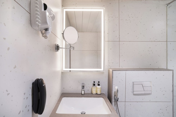 Imagen de la habitación del Hotel Lemon Tree Rajkot. Foto 16