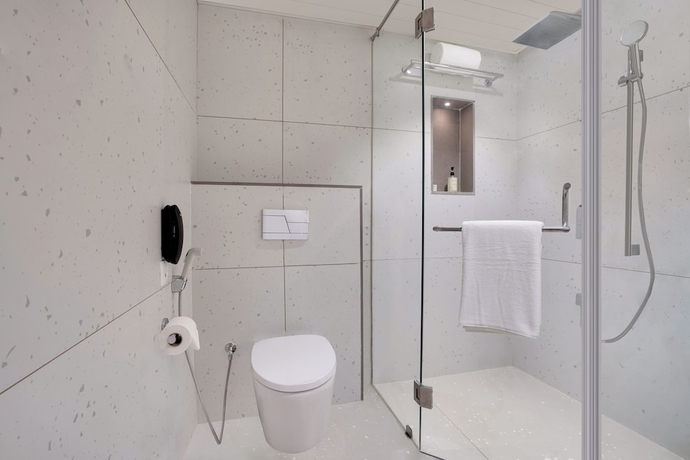Imagen de la habitación del Hotel Lemon Tree Rajkot. Foto 18