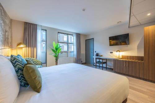 Imagen de la habitación del Hotel Leonardo Breda City Center. Foto 9