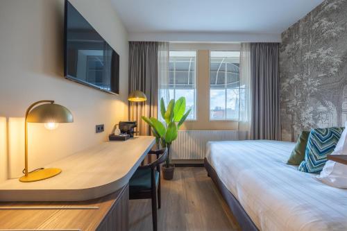 Imagen de la habitación del Hotel Leonardo Breda City Center. Foto 10