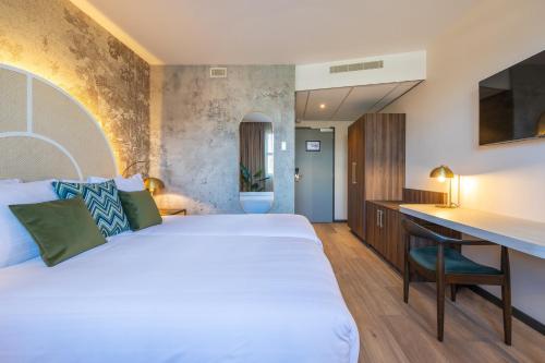 Imagen de la habitación del Hotel Leonardo Breda City Center. Foto 12