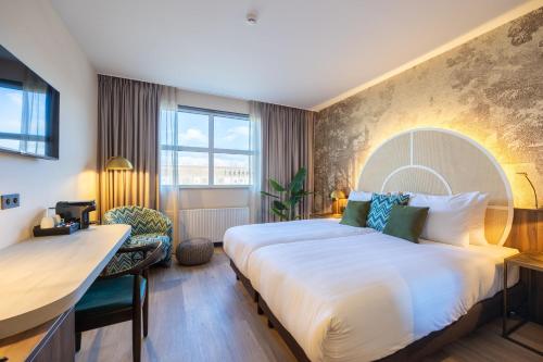 Imagen de la habitación del Hotel Leonardo Breda City Center. Foto 19