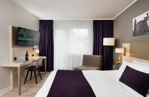 Imagen de la habitación del Hotel Leonardo Frankfurt City Center. Foto 16