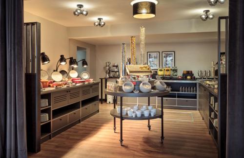 Imagen del bar/restaurante del Hotel Leonardo Hamburg Elbbruken. Foto 13