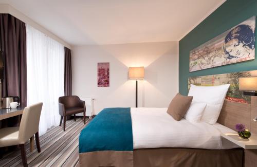 Imagen de la habitación del Hotel Leonardo Munich City Olympiapark. Foto 16