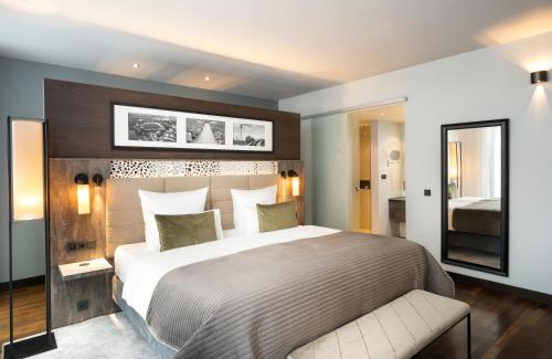 Imagen de la habitación del Hotel Leonardo Royal Munich. Foto 16