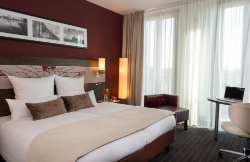 Imagen de la habitación del Hotel Leonardo Royal Munich. Foto 20