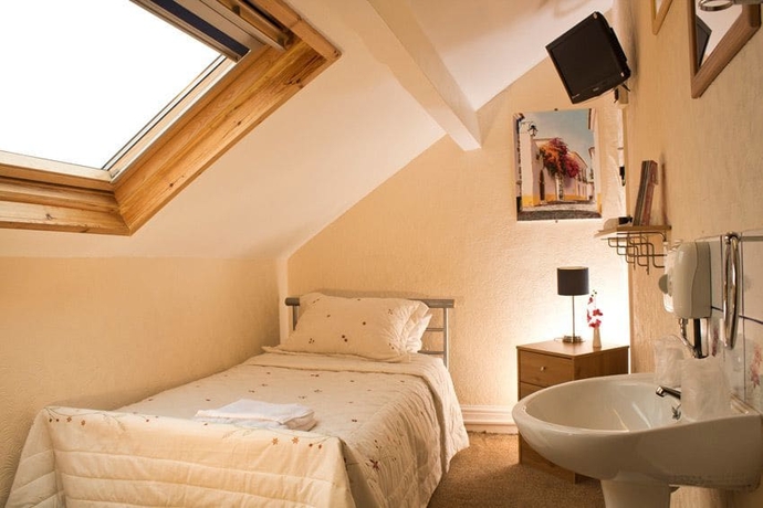 Imagen de la habitación del Hotel Leonardo's Guest House. Foto 10