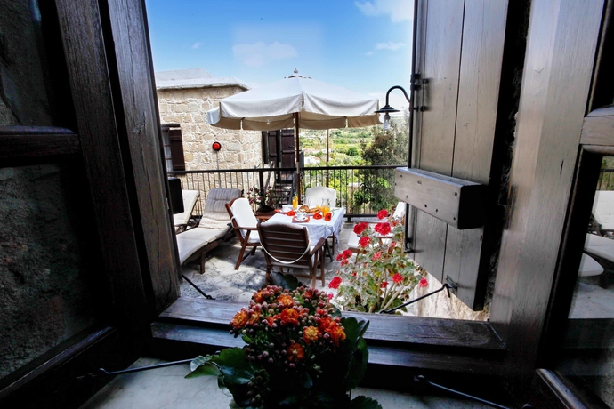 Imagen de la habitación del Hotel Leonidas Village Houses. Foto 7