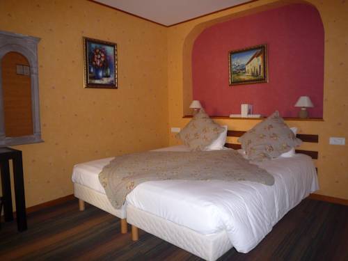 Imagen de la habitación del Hotel Les Arcades Le Lion D'or. Foto 15