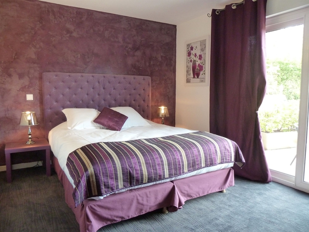 Imagen de la habitación del Hotel Les Bastides St Paul. Foto 5