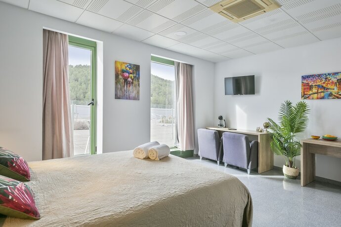 Imagen de la habitación del Hotel Les Begues Apartments. Foto 20